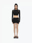 BELT CUT-OUT LONG SLEEVE DECONSTRUCTED KNIT TOP - BLACK
