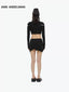 BELT CUT-OUT LONG SLEEVE DECONSTRUCTED KNIT TOP - BLACK
