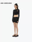 BELT CUT-OUT LONG SLEEVE DECONSTRUCTED KNIT TOP - BLACK